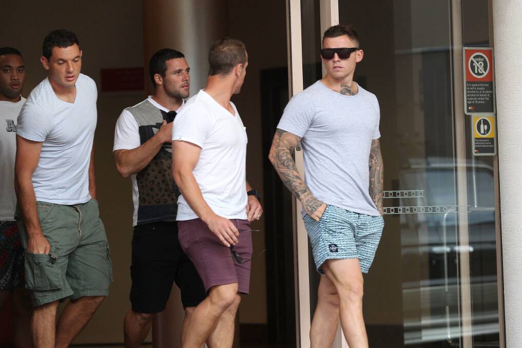 In shock: Sharks players leave the Rydges Hotel after being informed coaching staff had been sacked. Picture: John Veage
