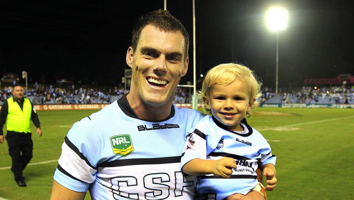 The Sharks start the season off with a win-John Morris and his son.Picture Chris Lane