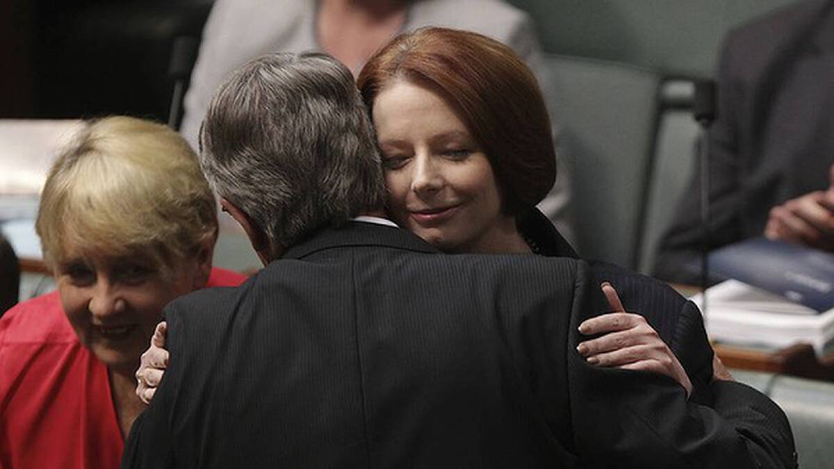 Prime Minister Julia Gillard gives Treasurer Wayne Swan a hug after he handed down the Budget in May. Photo: Alex Ellinghausen