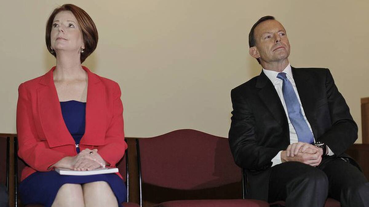Prime Minister Julia Gillard and Opposition Leader Tony Abbott sat together at a Fred Hollows Foundation event in August. Photo: Andrew Meares